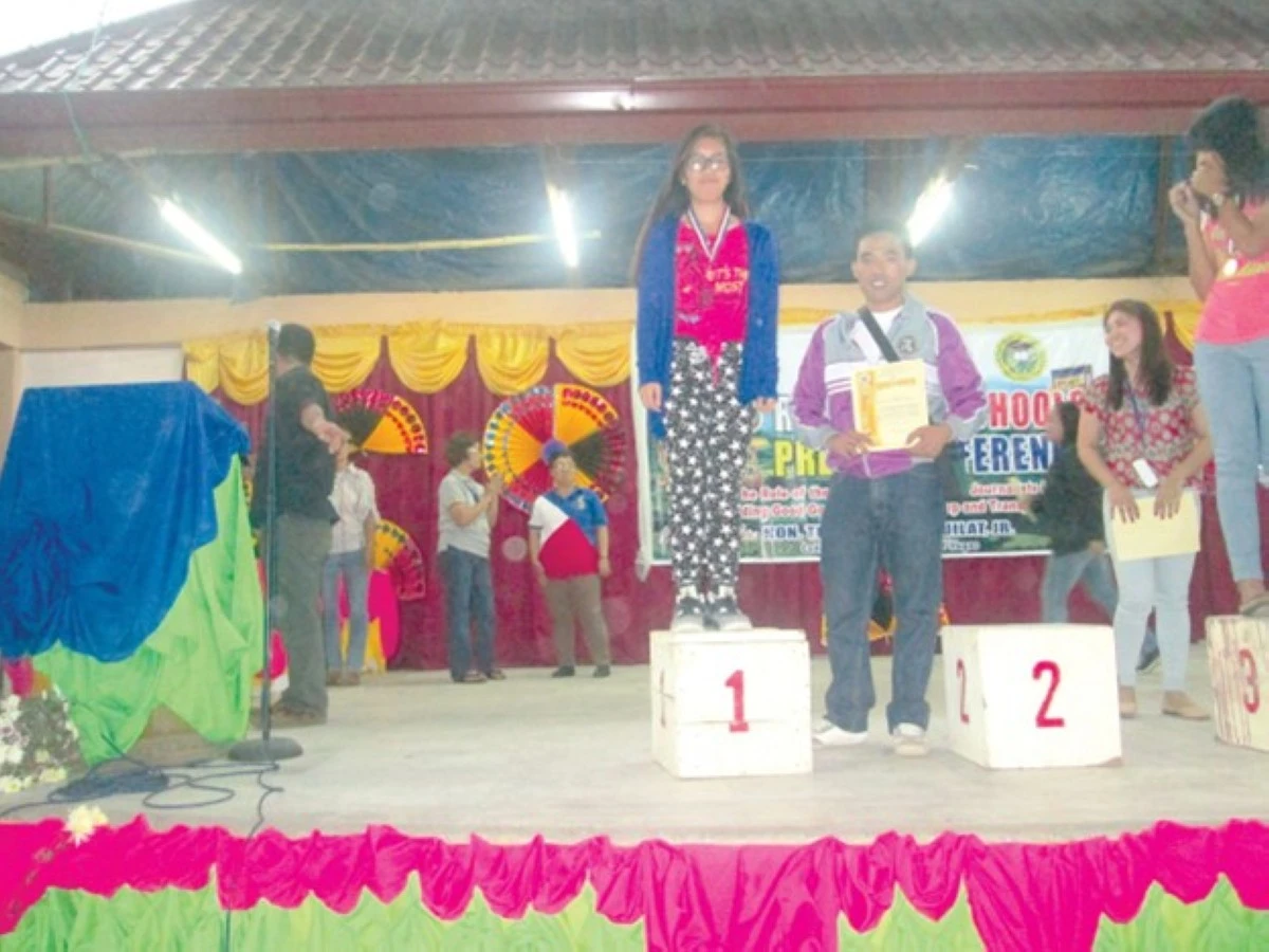 MARTES CALASAN (right) with his winning student.