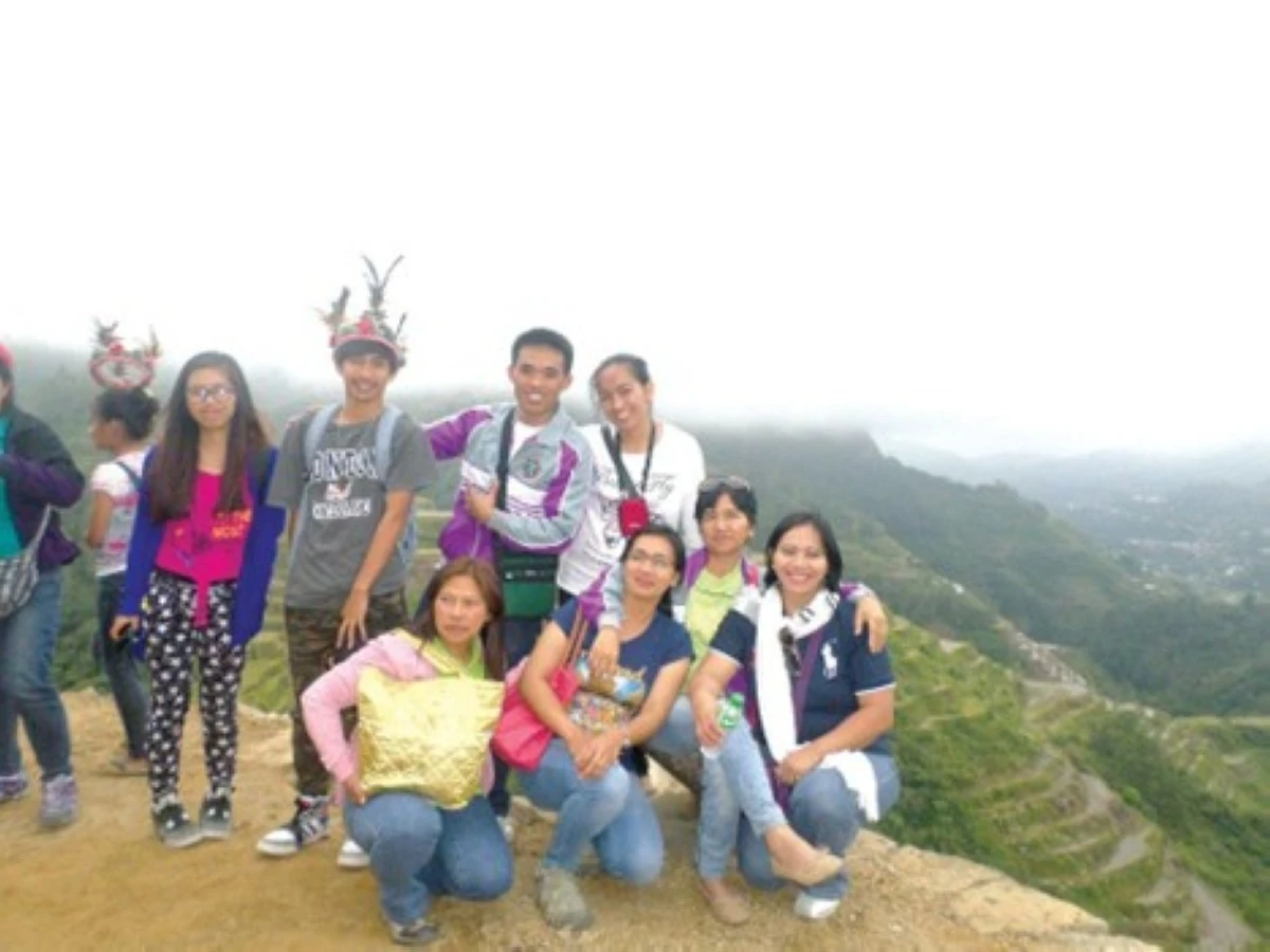 MARTES CALASAN (standing, third from left) along with his students and fellow teachers at the Banaue Rice Terraces.