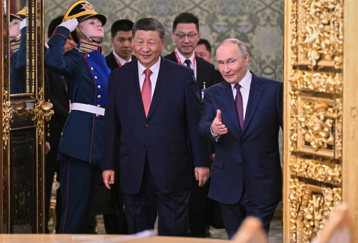 Russian President Vladimir Putin, right, and his Chinese counterpart Xi Jinping arrive for their talks at the Kremlin in Moscow, Russia, Thursday, May 8, 2025, ahead of celebrations of the 80th anniversary of the Soviet Union's victory over Nazi Germany during the World War II. (Alexei Danichev/Photo host agency RIA Novosti via AP)