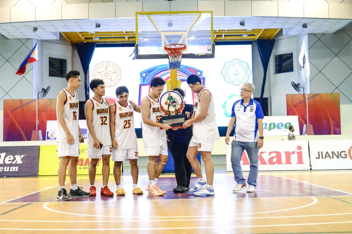 The UB Brahmans pose after receiving their UCAL 3x3 trophy from Tournament Director Horacio Lim, right. (UCAL)