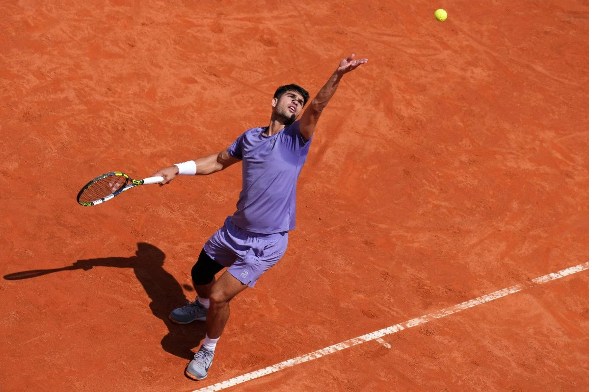 Spain's Carlos Alcaraz serves to Serbia's Dusan Lajovic during the Italian Open tennis tournament in Rome, Friday May 9. (Alfredo Falcone/LaPresse via AP)