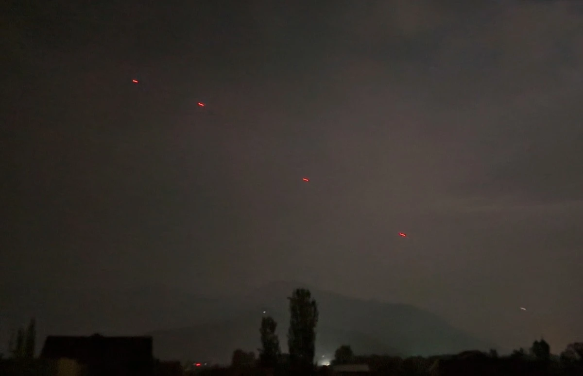 Red projectiles are seen over Srinagar, in Indian controlled Kashmir, Saturday, May 10, 2025. (AP Photo/Mukhtar Khan)