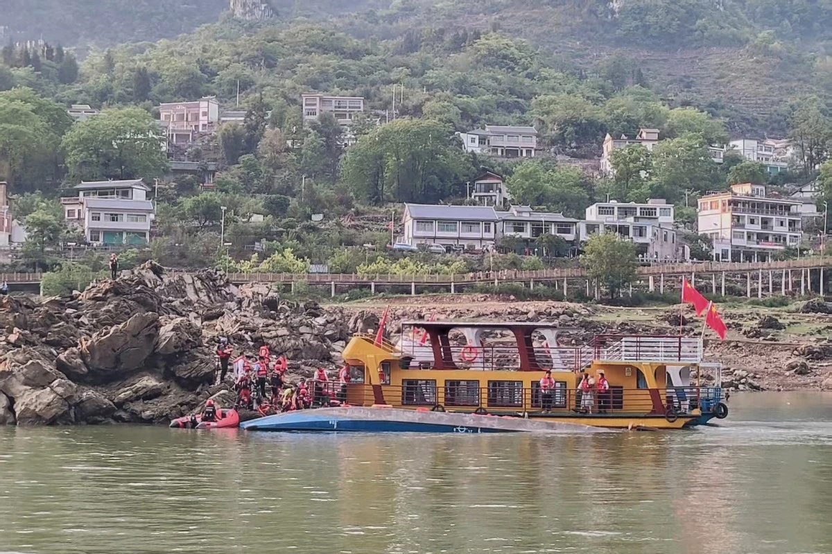 In this photo released by Xinhua News Agency, rescuers carrying out search and rescue operation at the site where two passenger boats capsized in Qianxi City, southwest China's Guizhou Province on Sunday, May 4, 2025. (Xinhua via AP)