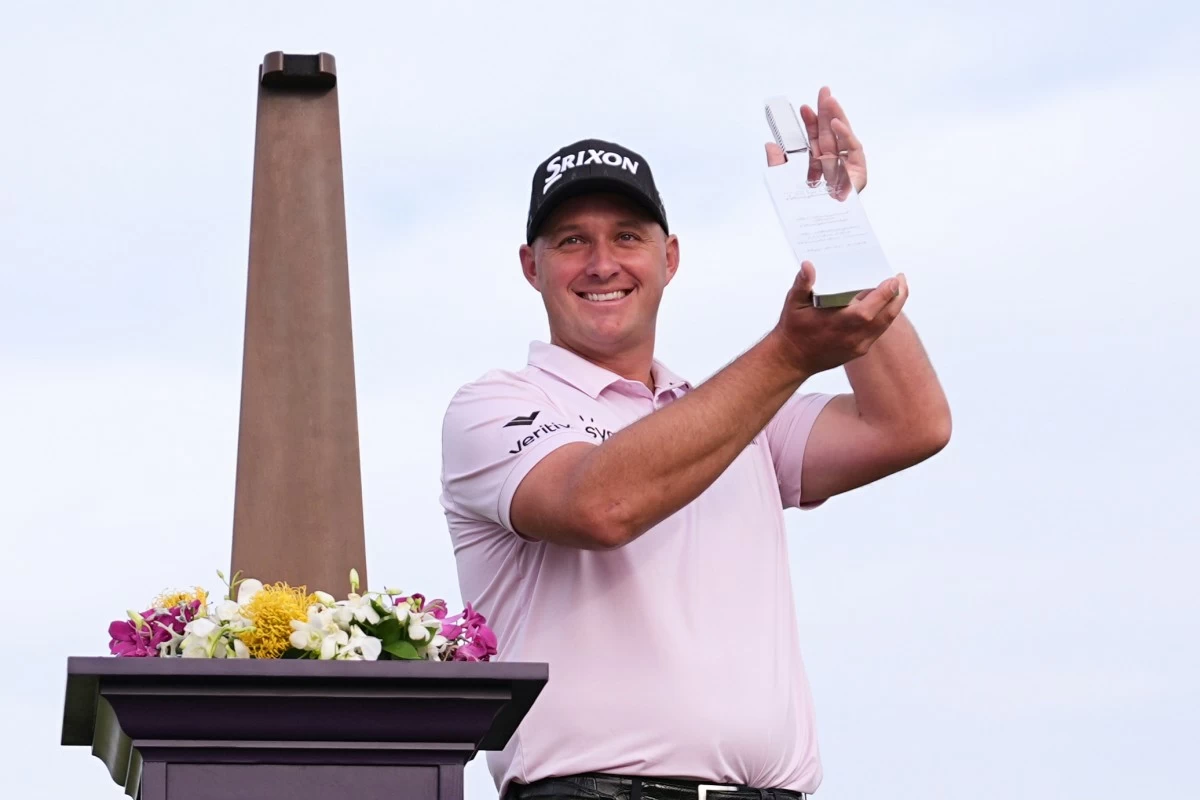 Sepp Straka, of Austria, poses with the trophy after winning the Truist Championship golf tournament at the Philadelphia Cricket Club, Sunday, May 11, in Flourtown. (AP Photo/Matt Rourke)