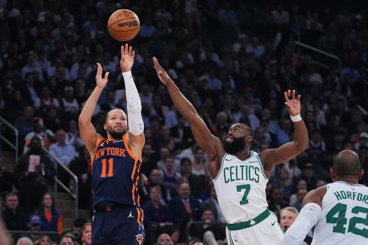 New York Knicks' Jalen Brunson (11) shoots over Boston Celtics' Jaylen Brown (7) during the first half of Game 4 in the Eastern Conference semifinals of the NBA basketball playoffs Monday, May 12, 2025, in New York. (AP Photo/Frank Franklin II)