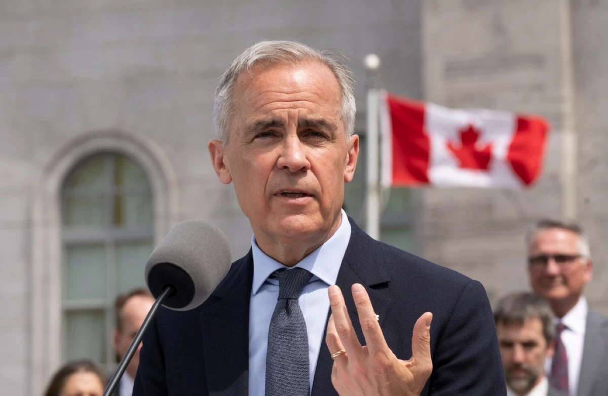 Canadian Prime Minister Mark Carney speaks to the media following a swearing-in ceremony at Rideau Hall in Ottawa, Ontario, Tuesday, May 13, 2025. (Christinne Muschi/The Canadian Press via AP)