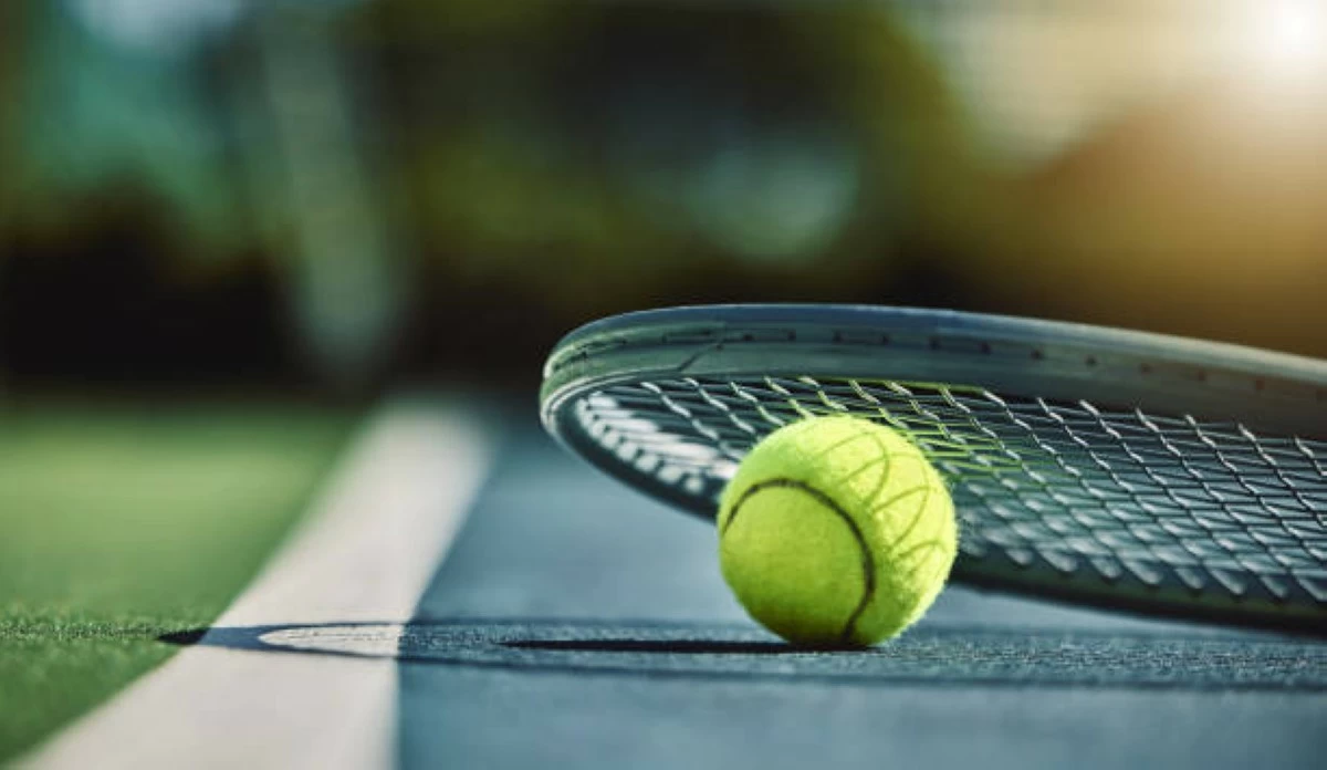 Tennis ball, racket and court ground with mockup space, blurred background or outdoor sunshine. Summer, sports equipment and mock up for training, fitness and exercise at game, contest or competition