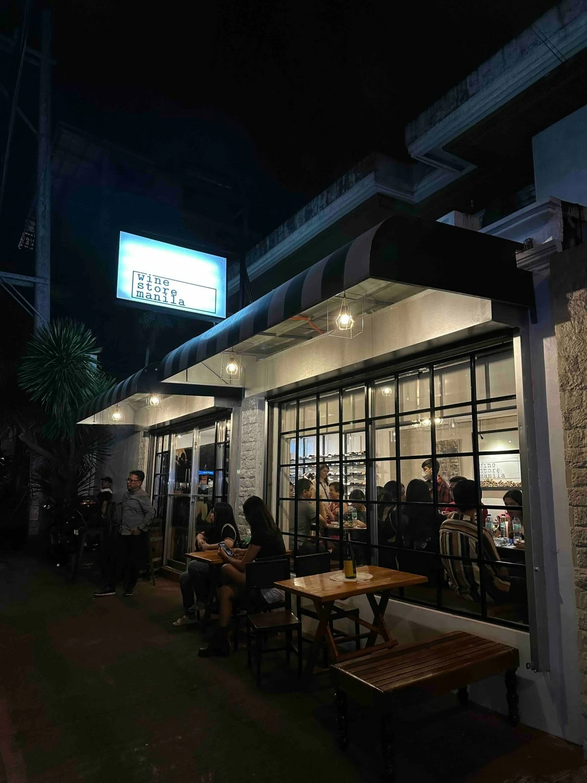 WINE STORE MANILA Unassuming from the outside, but warmly inviting—ready to welcome seekers of good food and even better wine.