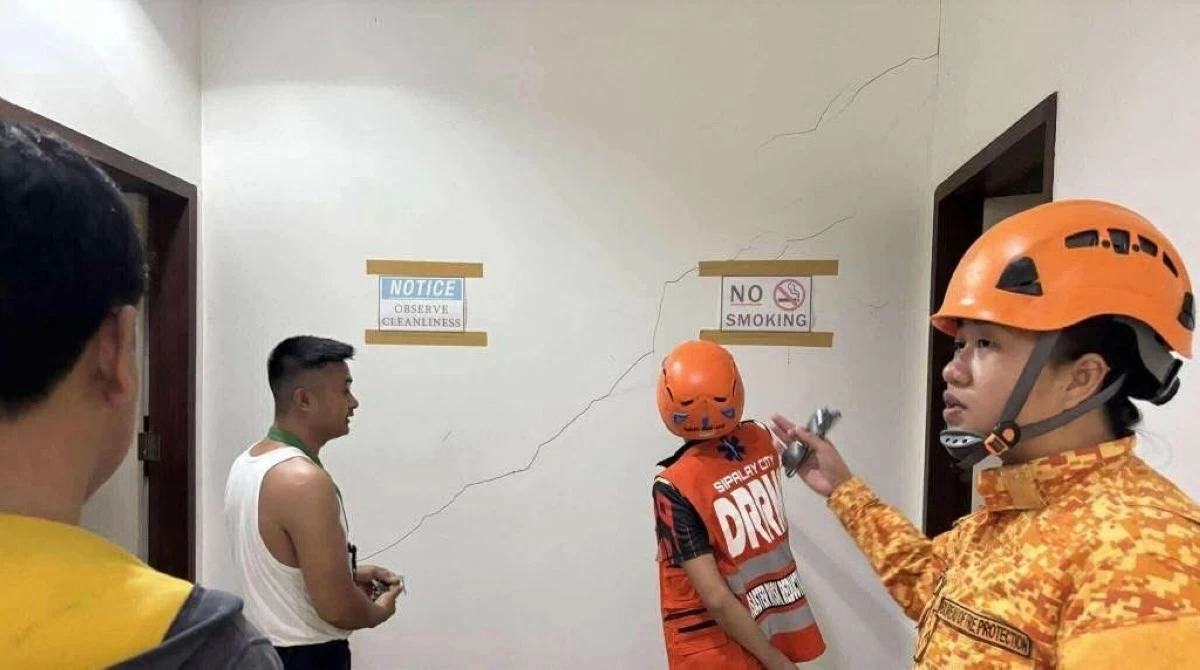 THE Bureau of Fire Protection inspects buildings that may have been affected by the 5.2-earthquake that hit Sipalay City, Negros Occidental on Saturday morning, May 17. (Photo via BFP-Sipalay City/FB)