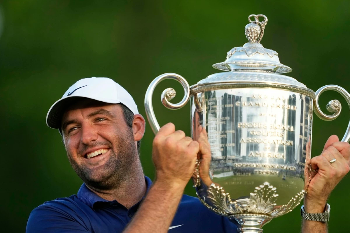 Scottie Scheffler holds the Wanamaker trophy after winning the PGA Championship golf tournament at the Quail Hollow Club, Sunday, May 18, 2025, in Charlotte, N.C. (AP Photo/Matt York)