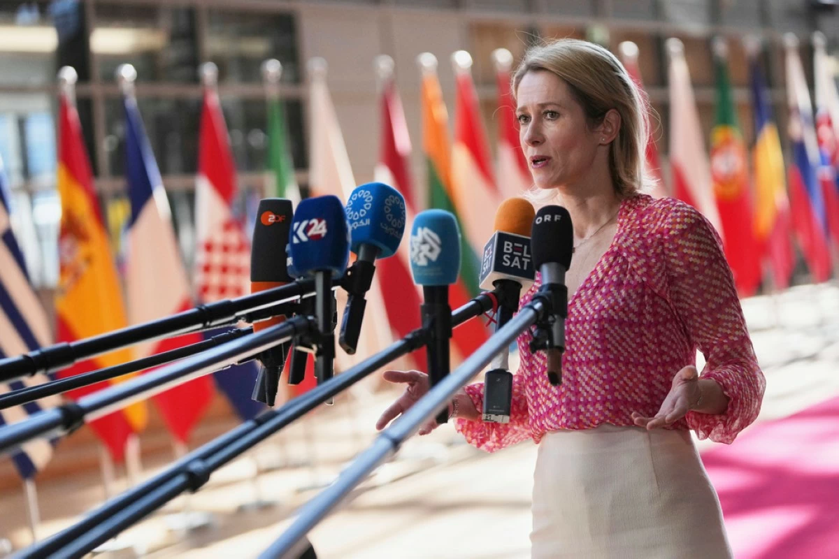European Union foreign policy chief Kaja Kallas speaks with the media as she arrives for a meeting of EU defense ministers at the European Council building in Brussels, Tuesday, May 20, 2025. (AP Photo/Virginia Mayo)