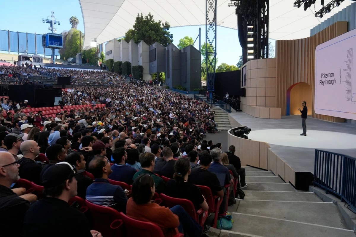 Alphabet CEO Sundar Pichai, right, speaks at a Google I/O event in Mountain View, Calif., Tuesday, May 20, 2025. (AP Photo/Jeff Chiu)