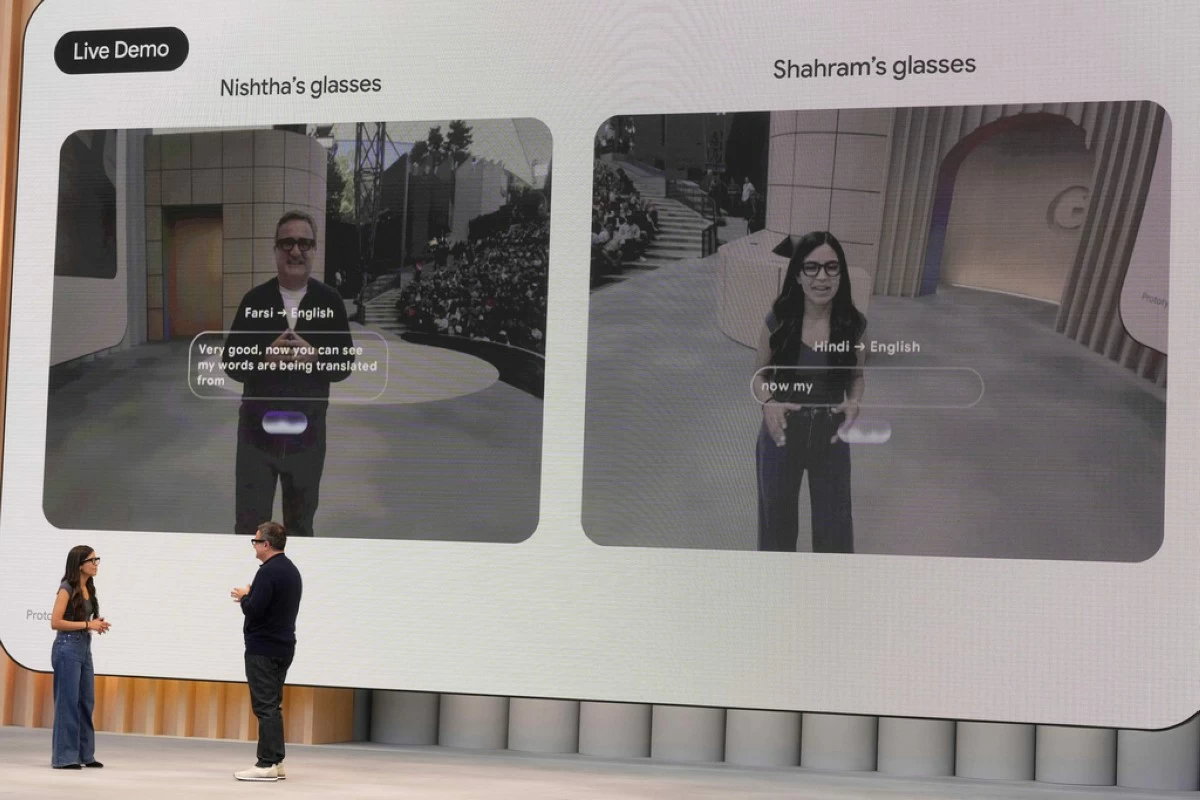 Nishtha Bhatia, Product Manager at Google, Glasses & AI, bottom left, and Shahram Izadi, Android XR Platform & Products, speak at a Google I/O event in Mountain View, Calif., Tuesday, May 20, 2025. (AP Photo/Jeff Chiu)