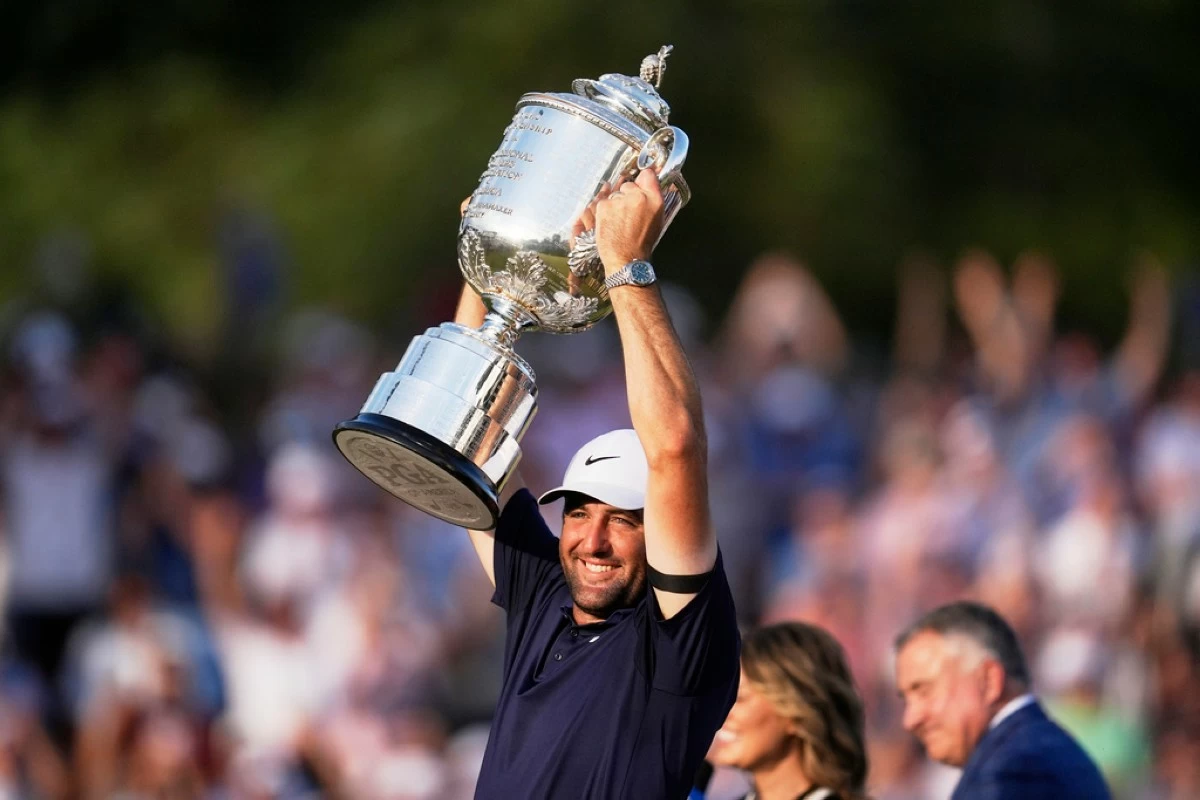 Scottie Scheffler holds the Wanamaker trophy after winning the PGA Championship golf tournament at the Quail Hollow Club, Sunday, May 18, in Charlotte, N.C. (AP Photo/George Walker IV)