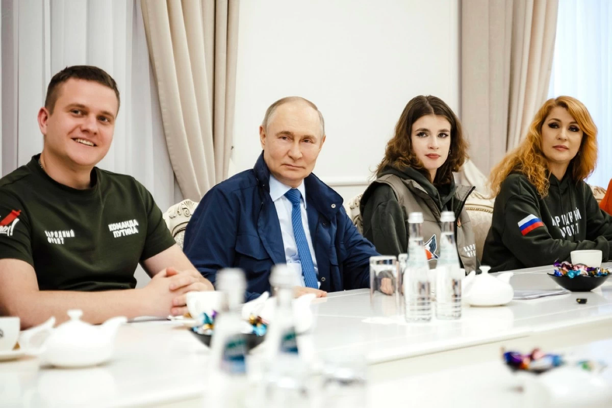 In this photo released by the Russian Presidential Press Service on Wednesday, May 21, 2025, Russian President Vladimir Putin, 2nd left, attends a meeting with volunteers at Kursk region, Russia. (Russian Presidential Press Service via AP)