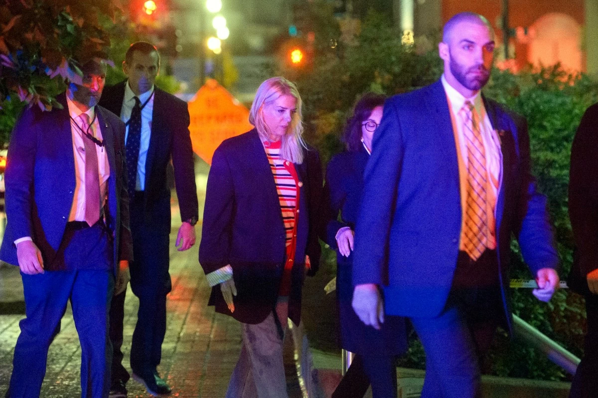 ATTORNEY General Pam Bondi (center) walks to her car as law enforcement work the scene after two staff members of the Israeli Embassy in Washington were shot and killed outside the Capital Jewish Museum, Thursday, May 22, 2025, in Washington. (AP)
