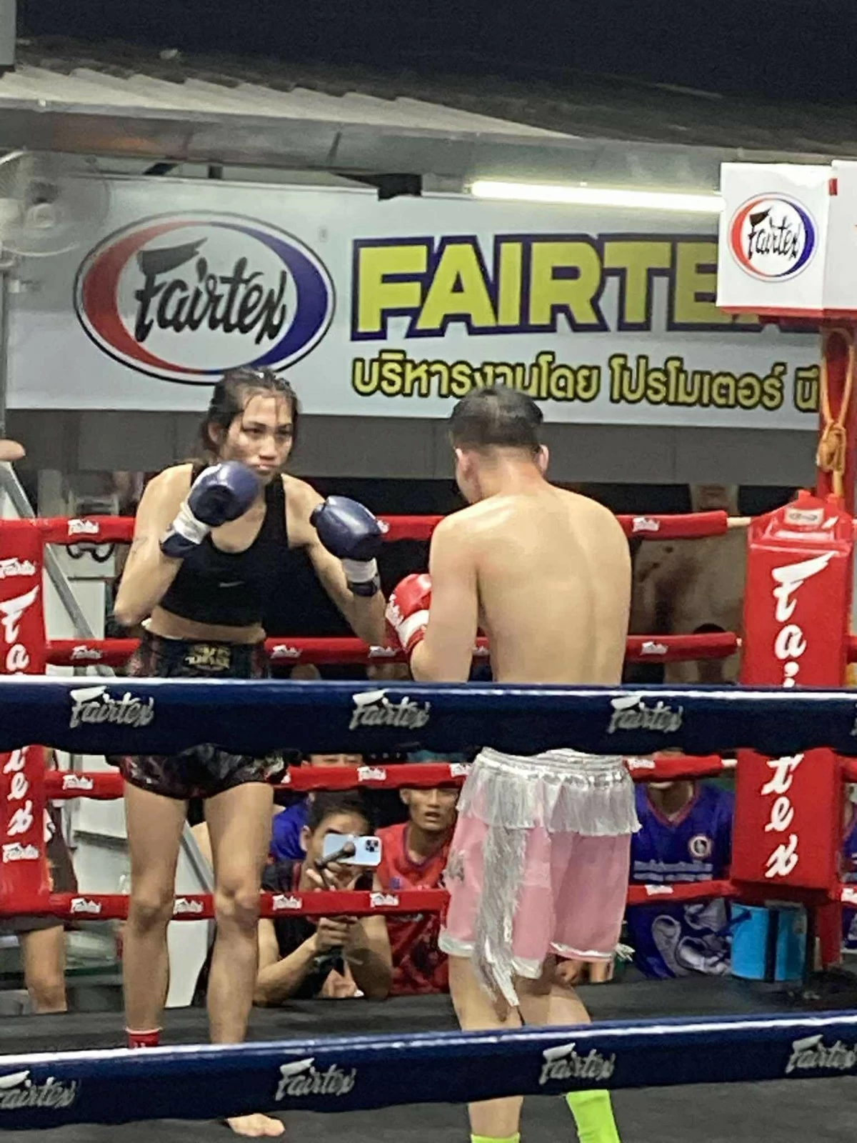 FIGHT NIGHT One of the competing Muay Thai boxers, who goes by the name of 'Ladyboy,' puts up quite a fight against their opponent..