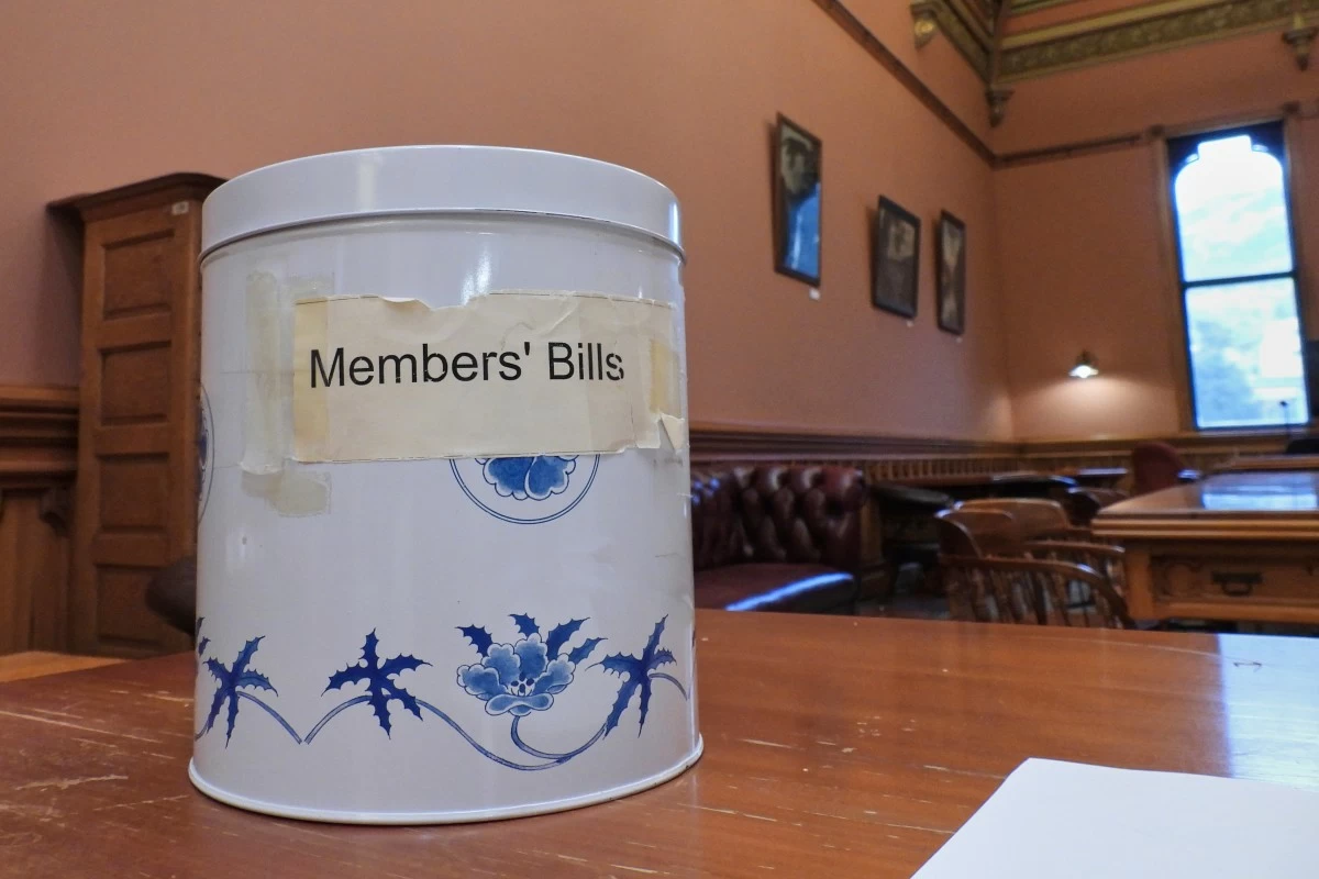 The decorative cookie tin, known in New Zealand as the biscuit tin, which was purchased from a department store in the early 1990s to draw lawmakers' bills from and remains in use, at Parliament in Wellington, New Zealand, Thursday, May 22, 2025. (AP Photo/Charlotte Graham-McLay)