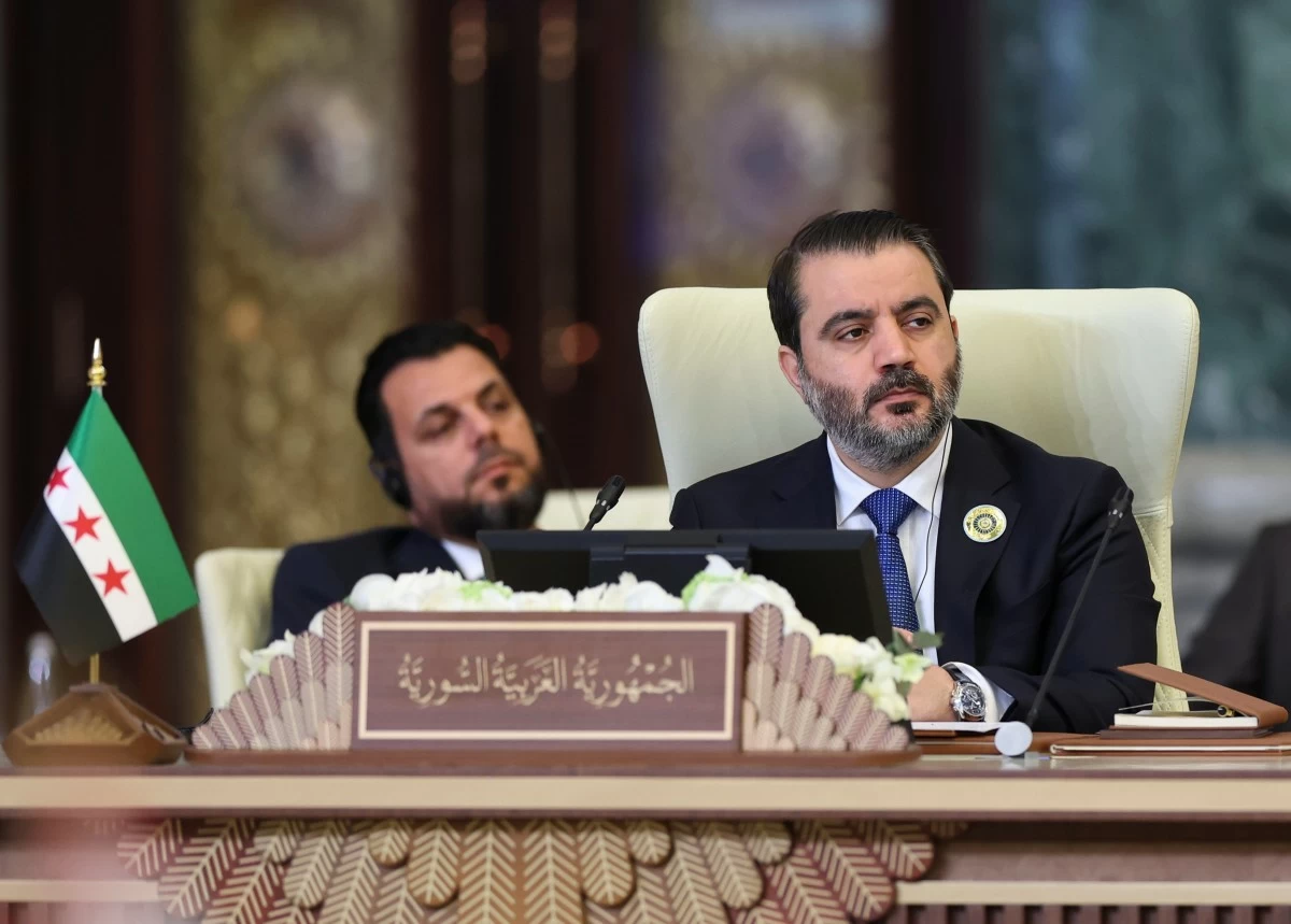 Syrian Foreign Minister Asaad al-Shibani attends the 34th Arab League summit, in Baghdad, Iraq, Saturday, May 17, 2025. (Thaier Al-Sudani/Pool via AP)