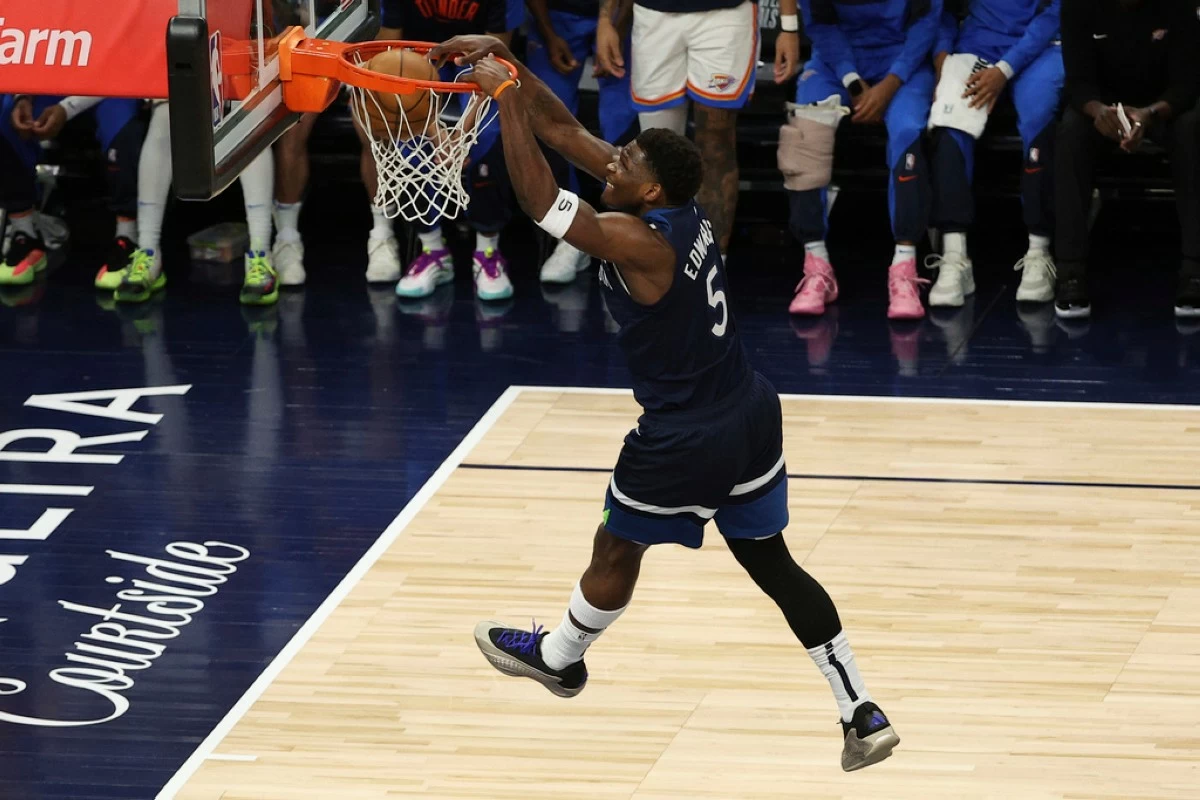 Minnesota Timberwolves guard Anthony Edwards (5) dunks during the first half of Game 3 of the Western Conference finals of the NBA basketball playoffs against the Oklahoma City Thunder, Saturday, May 24, 2025, in Minneapolis. (AP Photo/Matt Krohn)