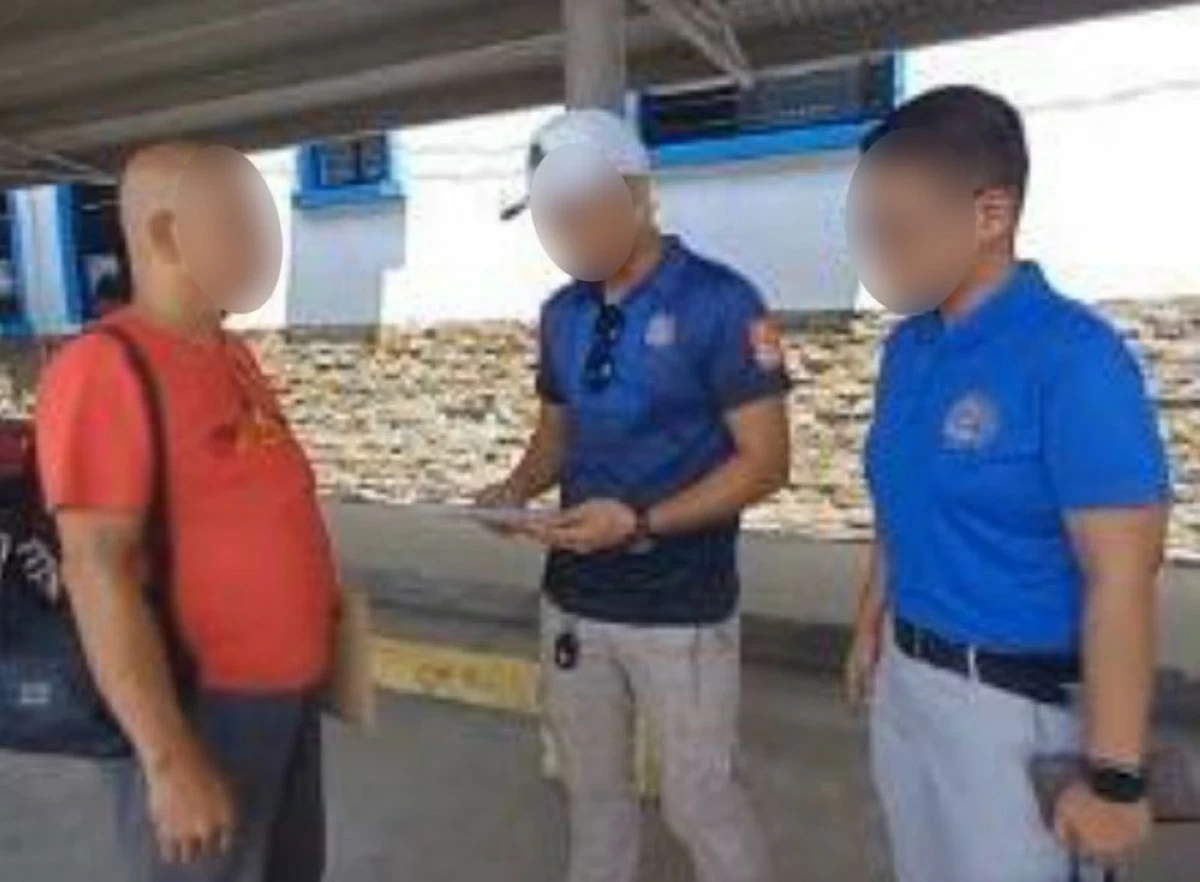 CIDG operatives serve the arrest warrant for a non-bailable case of human trafficking against one of the co-accused of lawyer Harry Roque and Cassy Ong. (photo: CIDG)