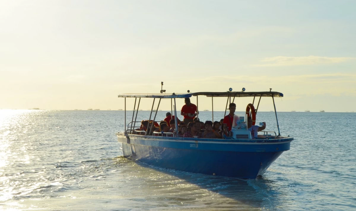 Guests enjoy a serene Cruise By the Bay tour at SM By the BAY Amusement Park.
