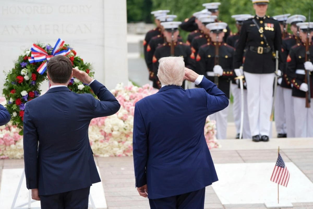 President Donald Trump, right, salutes at the Tomb of the Unknown Soldier, on Memorial Day at Arlington National Cemetery, in Arlington, Va., Monday, May 26, 2025. (AP Photo/Jacquelyn Martin)