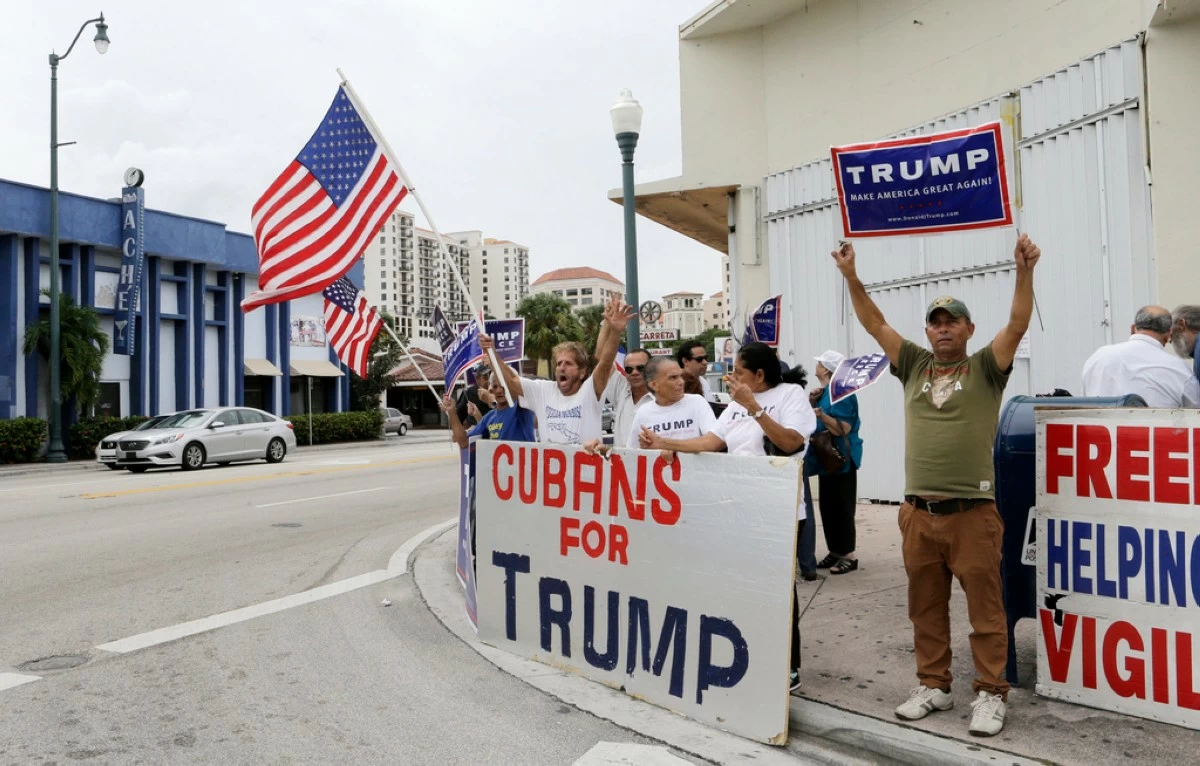 FILE - Cuban-Americans chant pro-Trump slogans as they show their support for Republican presidential candidate Donald Trump in Miami on Oct. 28, 2016. (AP Photo/Alan Diaz, File)