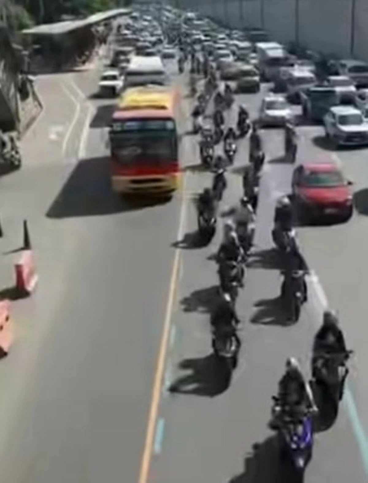 A screen grab from the video of the MMDA shows motorcycles staying on the motorcycle lane along Commonwealth Avenue, with authorities attributing the sudden display of discipline to the implementation of the No-Contact Apprehension Policy (NCAP). 