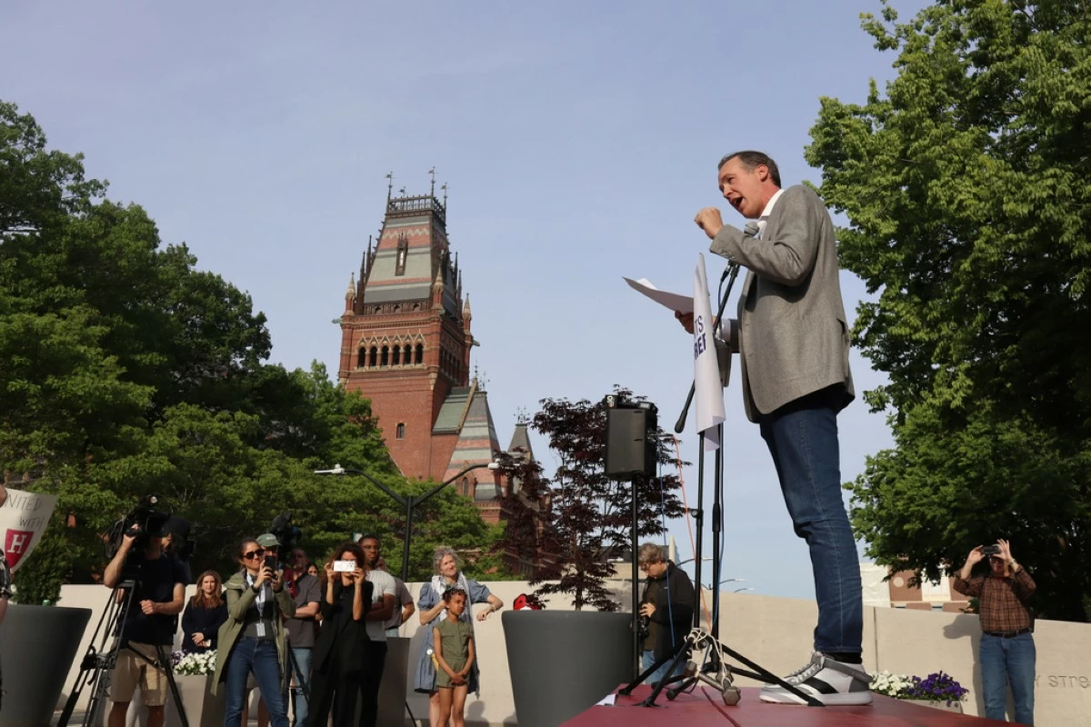Ryan Enos, a government professor at Harvard University, speaks at a protest against President Donald Trump's recent sanctions against Harvard in front of Science Center Plaza on Tuesday, May 27, 2025, in Cambridge, Mass. (AP Photo/Leah Willingham)