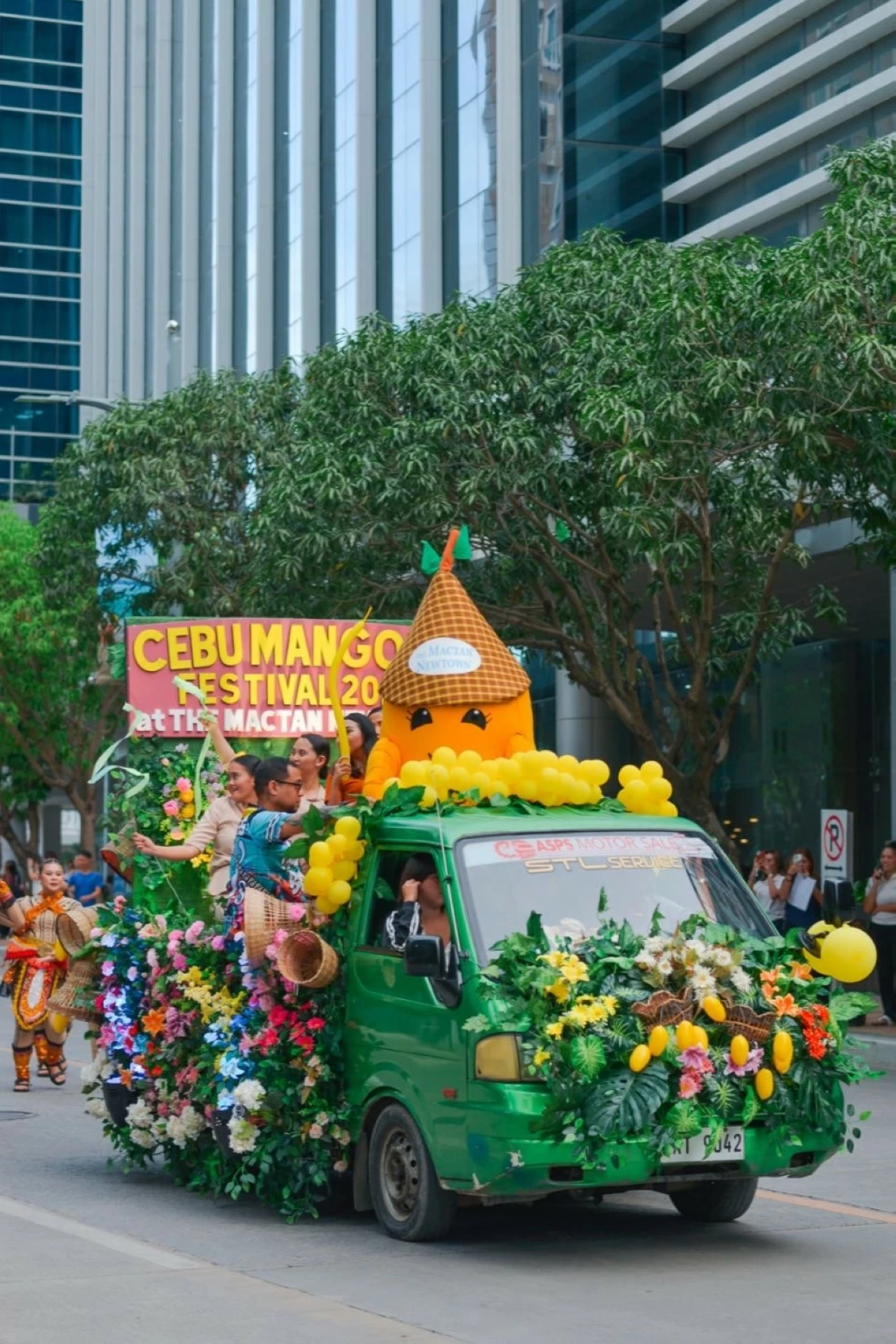 The cute and adorable festival mascot, Jodie Mango, smiles at the crowd as they make their way to the event area for the opening of the Cebu Mangoes Festival 2025.