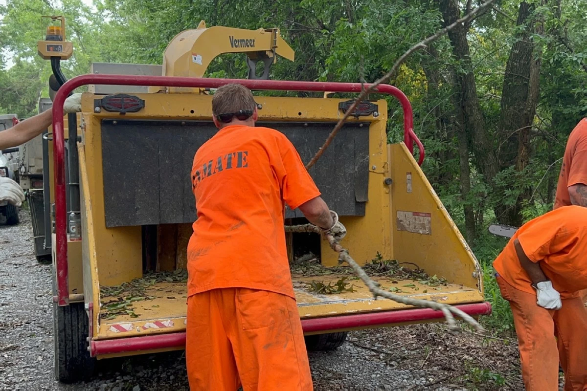 This photo taken on May 27, 2025, provided by the Oklahoma Department of Corrections shows a crew of inmates helping clean up tornado damage in the community of Blanco in Pittsburg County in Oklahoma (Lance West/Oklahoma Department of Corrections via AP)