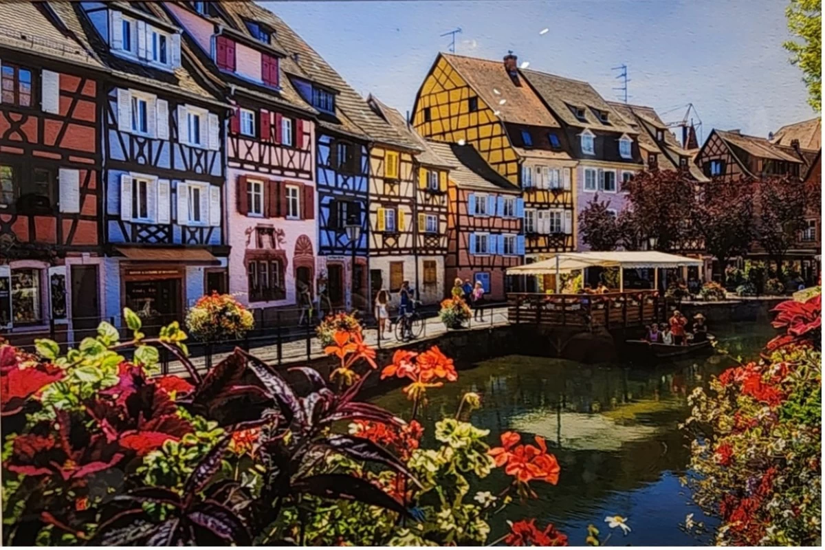 Colorful medieval houses along a canal in Colmar, France. ‘Charming Colmar’ by Sergey Guk  