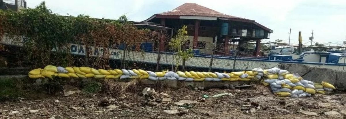 Sandbags placed along critical waterways to strengthen riverbanks and help prevent flooding in several barangays (Photo from Malabon City PIO)