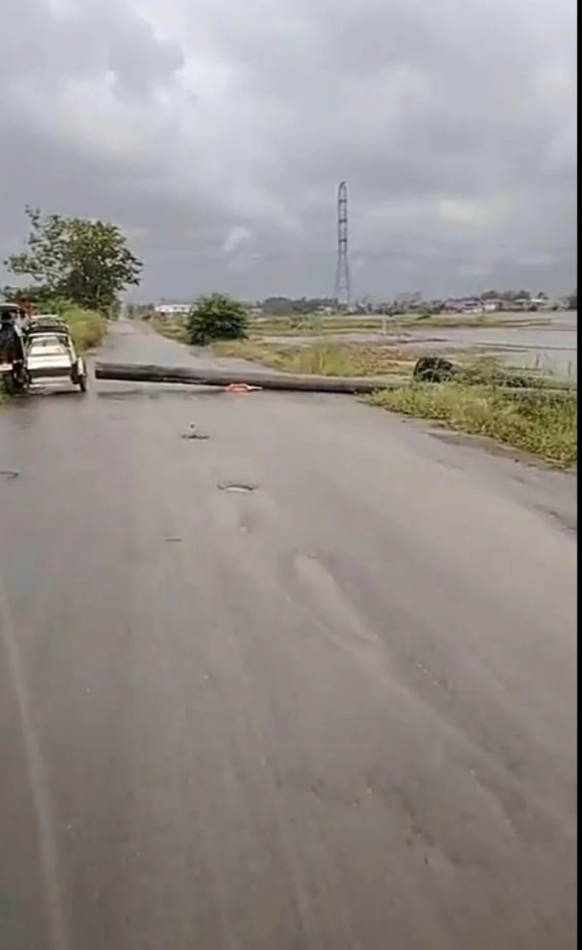Meralco linemen reinstall several electric posts that collapsed in Barangay Bulusan, Calumpit, Bulacan, at the height of strong winds and heavy downpour on Friday afternoon, June 6, 2025. (Photo from the official Facebook page of Mayor Lem Faustino)