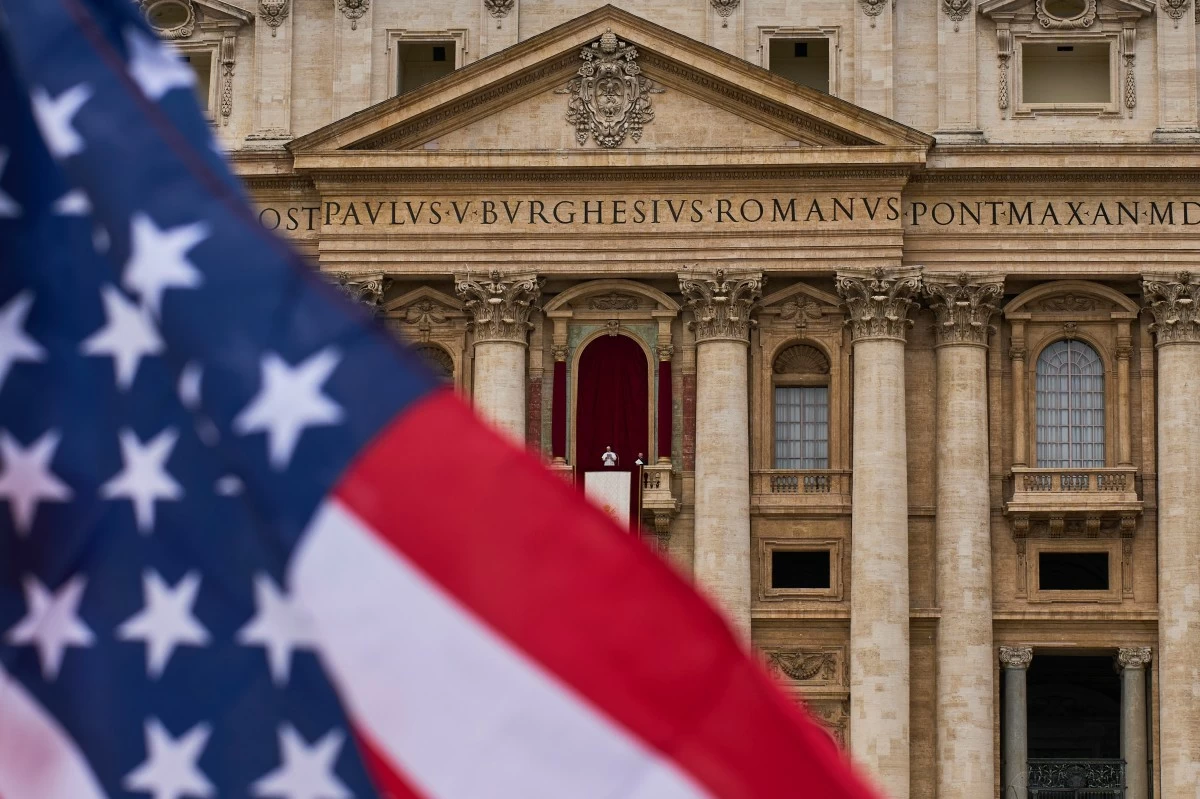 A FLAG from the United States waves from the crowd as Pope Leo XIV appears at the central balcony of Saint Peter's Basilica for his first Sunday blessing after his election in Saint Peter's Square at the Vatican, Sunday, May 11, 2025. (AP)