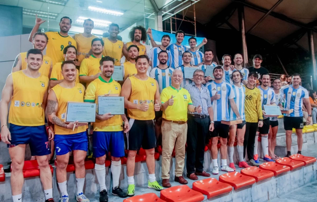 Members of the Brazilian and Argentine communities in the Philippines after the friendly match and award ceremony
