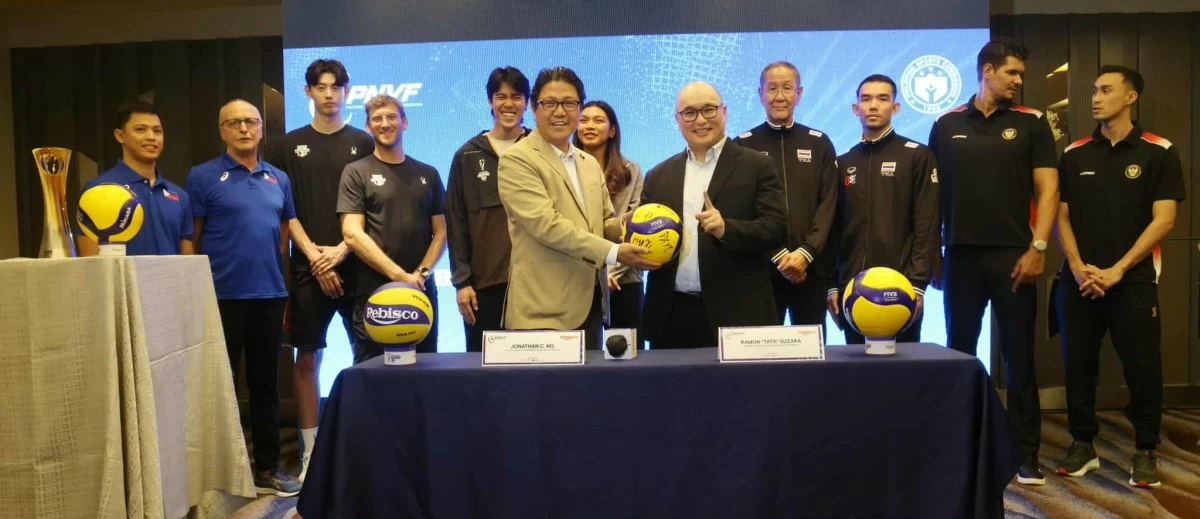 Tats Suzara hands symbolic ball to Jonathan Ng. Behind are coaches and captains.