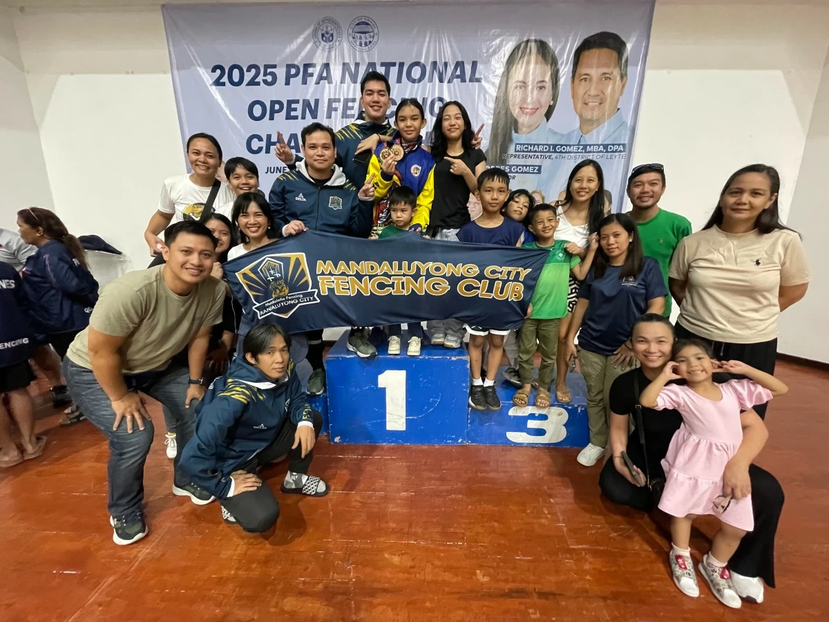 Fencers, coaches and supporters of Mandaluyong Fencing Club celebrate the two gold medal wins of Kyrsten Danielle “KD” Cabuñag (center podium) during the final day of the Philippine Fencing Association (PFA) Minime Tournament during the weekend at the Ormoc City Superdome in Leyte. (Mandaluyong Fencing Club Photo)