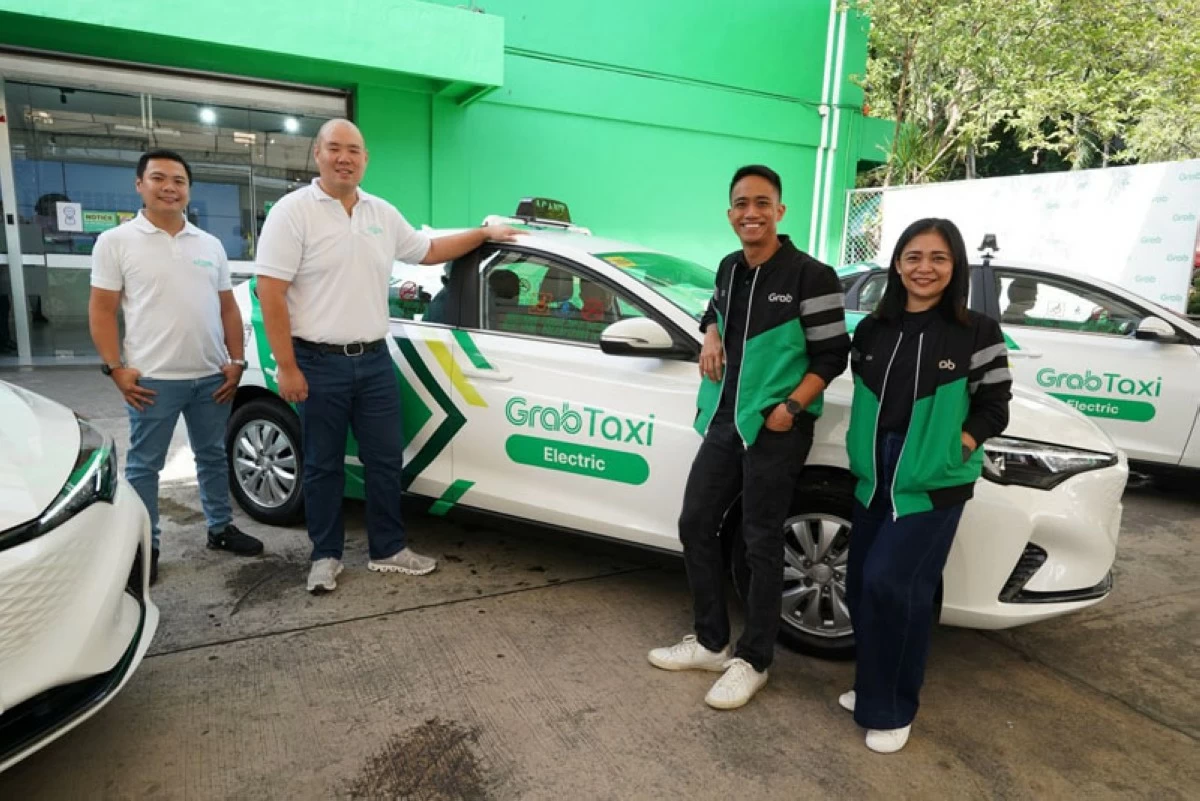 EV Taxi Corp. and Grab Philippines executives with the new GrabTaxi Electric.