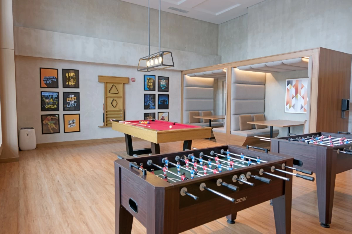 Billiards and foosball tables, board games, and smart televisions make the game room fun and exciting.