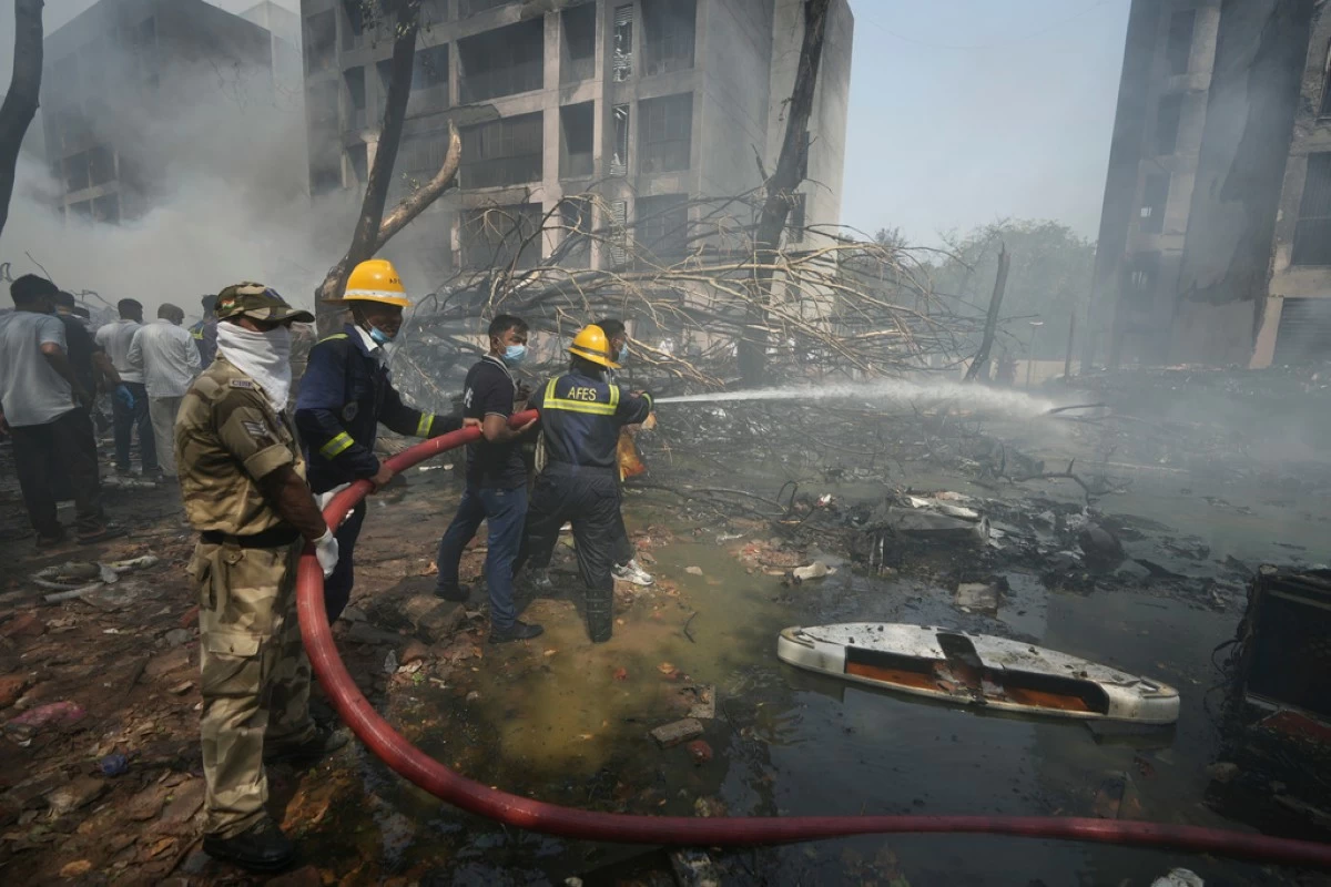 Firefighters work at the site of an airplane that crashed in India's northwestern city of Ahmedabad in Gujarat state, Thursday, June 12, 2025. (AP Photo/Ajit Solanki)