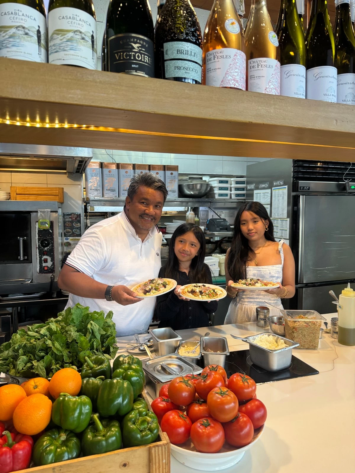 Rocio and Luccia with dad Robby Goco, executive chef and restaurateur–research and development for Cyma, Souv By Cyma, Elaia By Cyma, Rob’s, and Cangrejos Locos