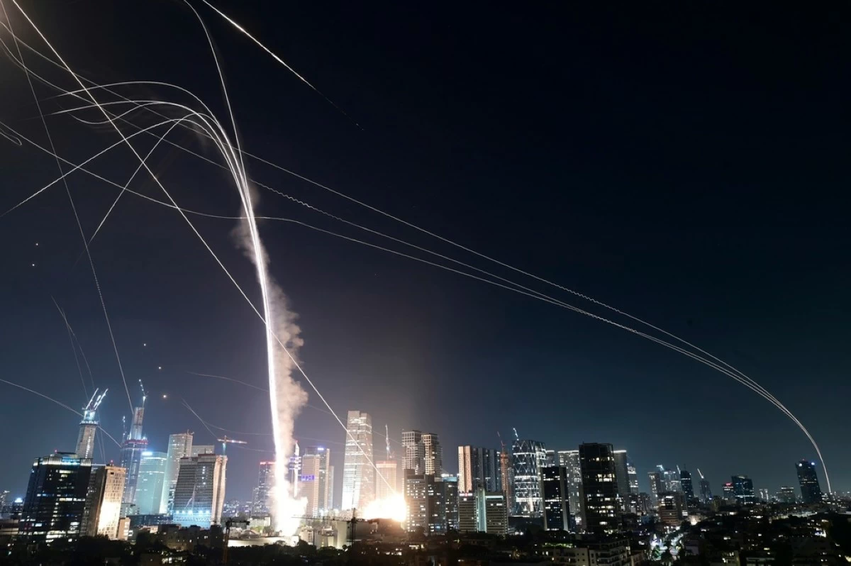 Israeli Iron Dome air defense system fires to intercept missiles over Tel Aviv, Israel, Friday, June 13, 2025. (AP Photo/Tomer Neuberg)