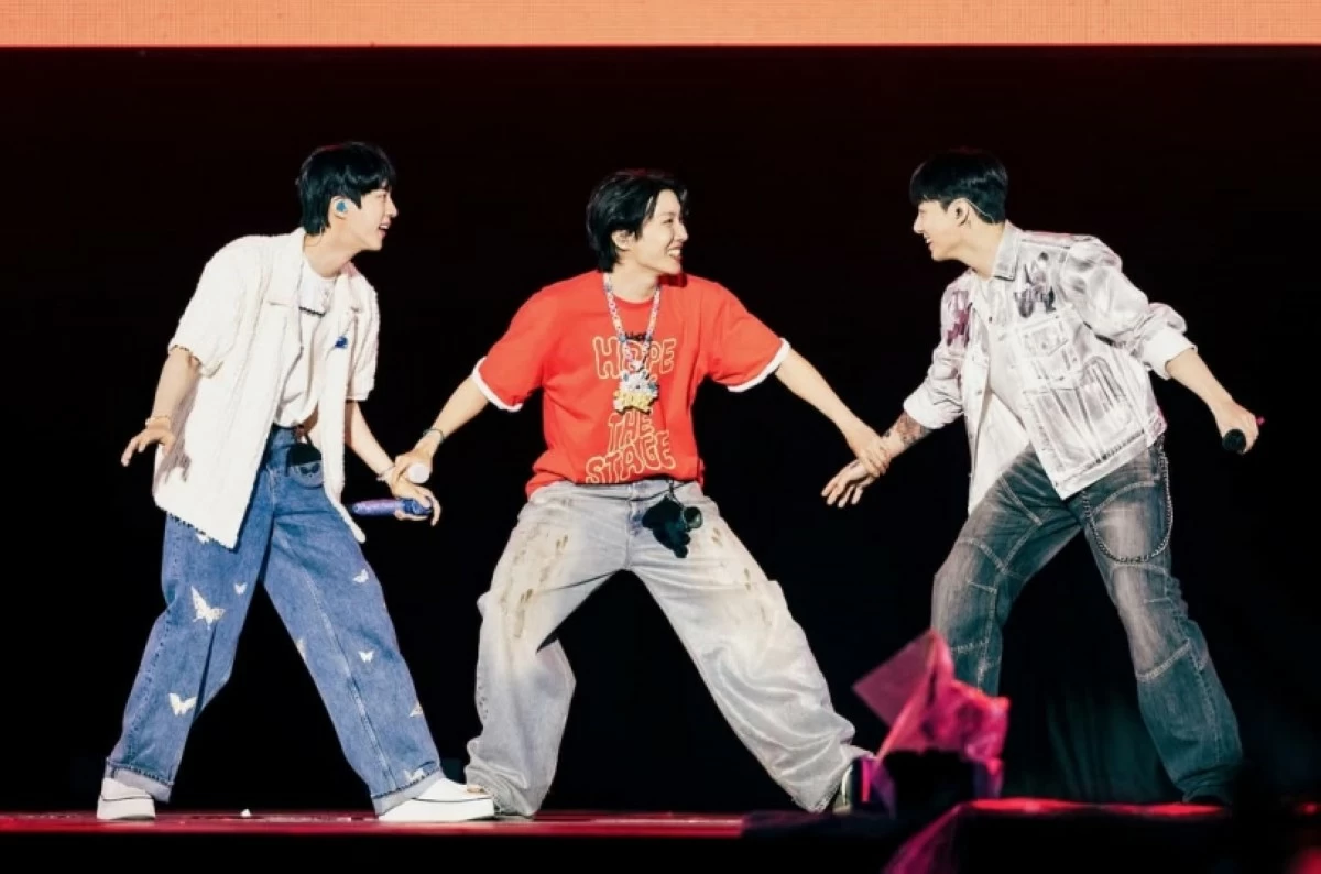 (From left) BTS' Jin, J-Hope and Jungkook performing at the 