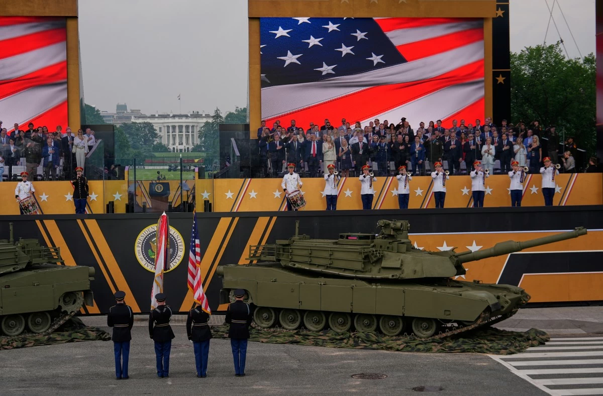 The National Anthem is performed as President Donald Trump attends a military parade commemorating the Army's 250th anniversary, coinciding with his 79th birthday, Saturday, June 14, 2025, in Washington. (AP Photo/Julia Demaree Nikhinson)