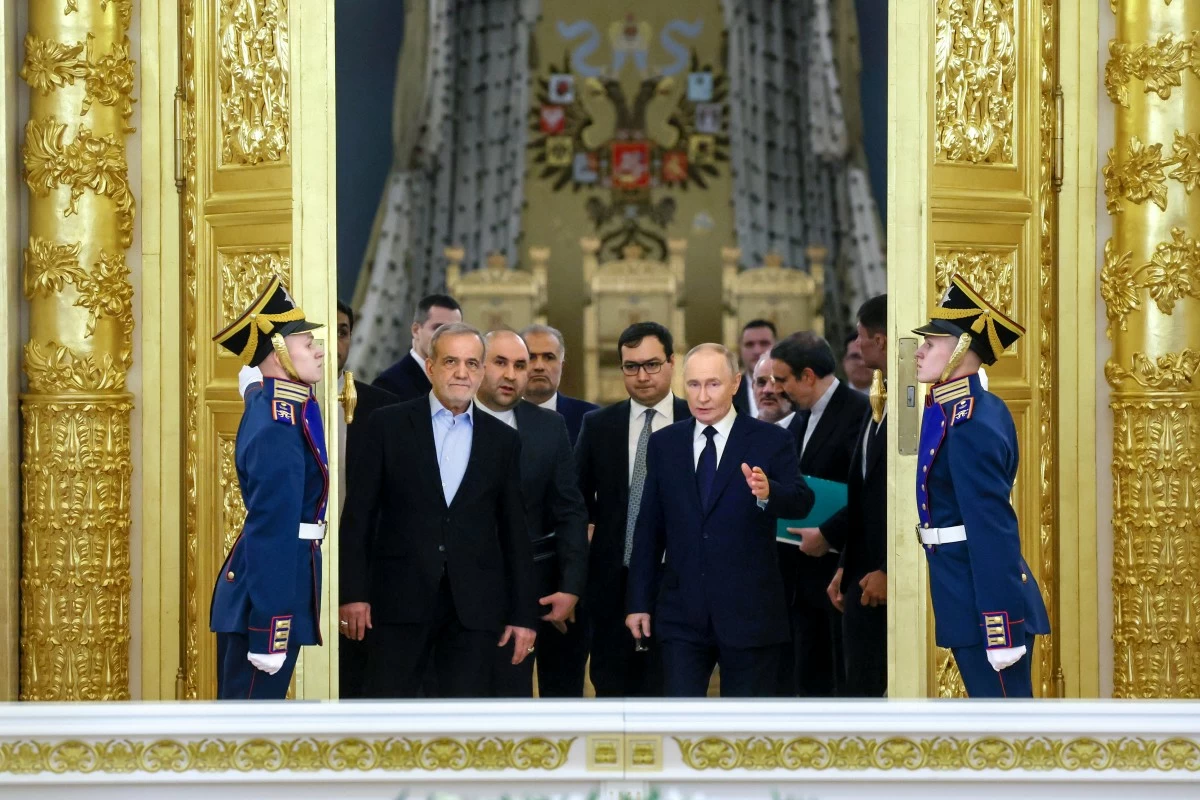 FILE - Iranian President Masoud Pezeshkian, center left, and Russian President Vladimir Putin, center right, arrive for a signing ceremony following talks at the Kremlin in Moscow, Russia, on Friday, Jan. 17, 2025. (Vyacheslav Prokofyev, Sputnik, Kremlin Pool Photo via AP, File)