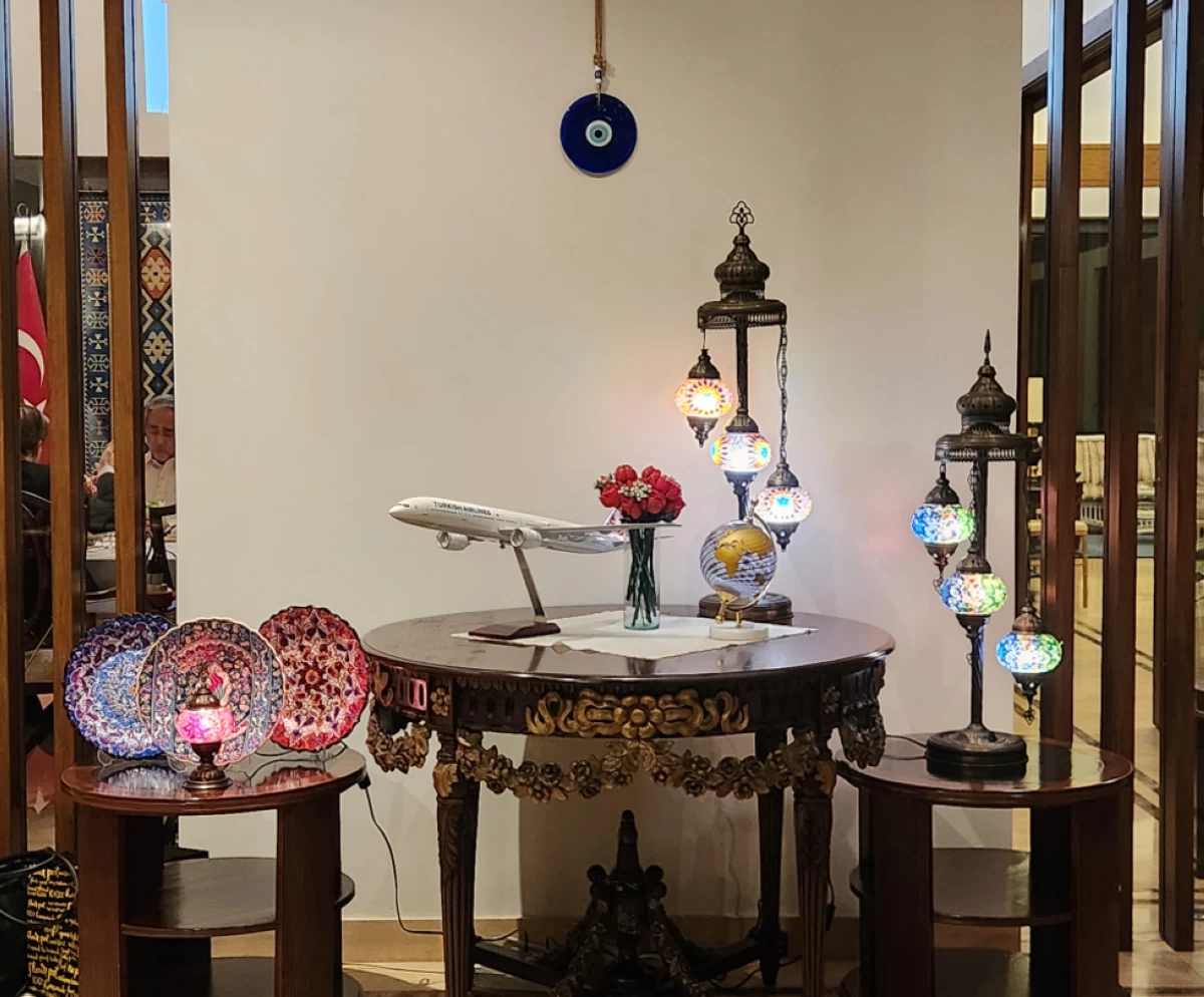 This Turkish themed display with  mosaic lamps, Iznik pottery and the Nazar  amulet  will greet you in the receiving area of the residence