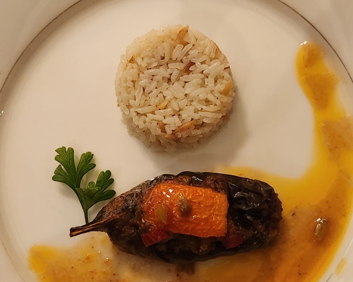 Karniyarik (split eggplant filled with minced meat)  served with Sehriyeli Pilav (rice pilaf with vermicelli)