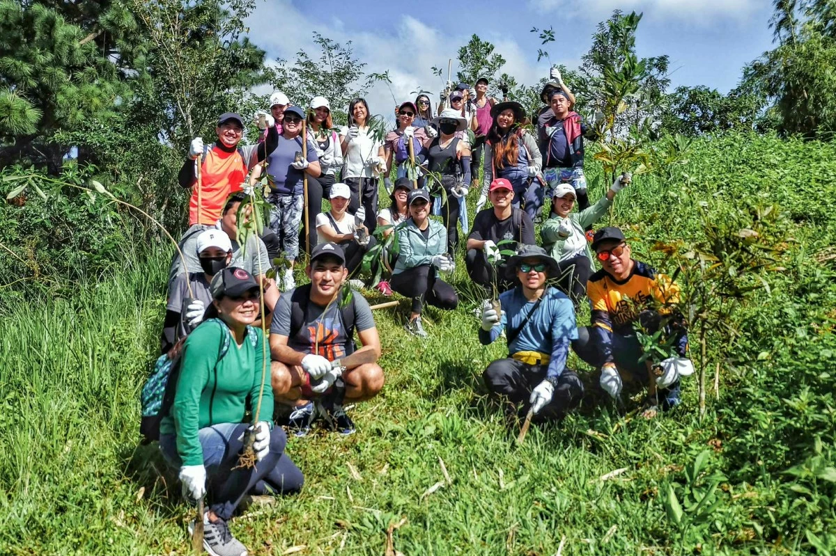 Visitors at the Masungi Geopark Project assist rangers in weeding, mulching, and planting.